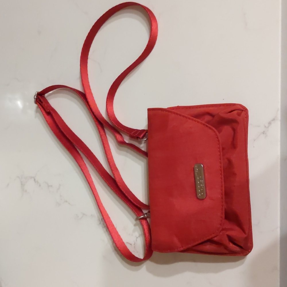Baggalini mini red canvas purse. Crossbody strap. 6"X4 1/2" when closed.